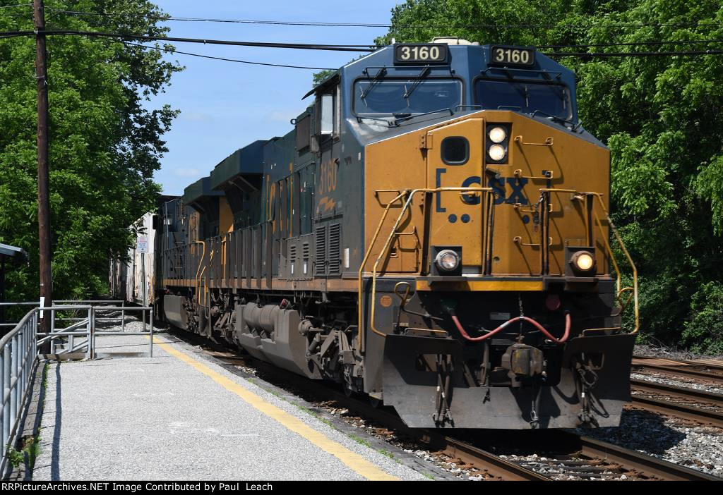 Intermodal cruises east past the platforms